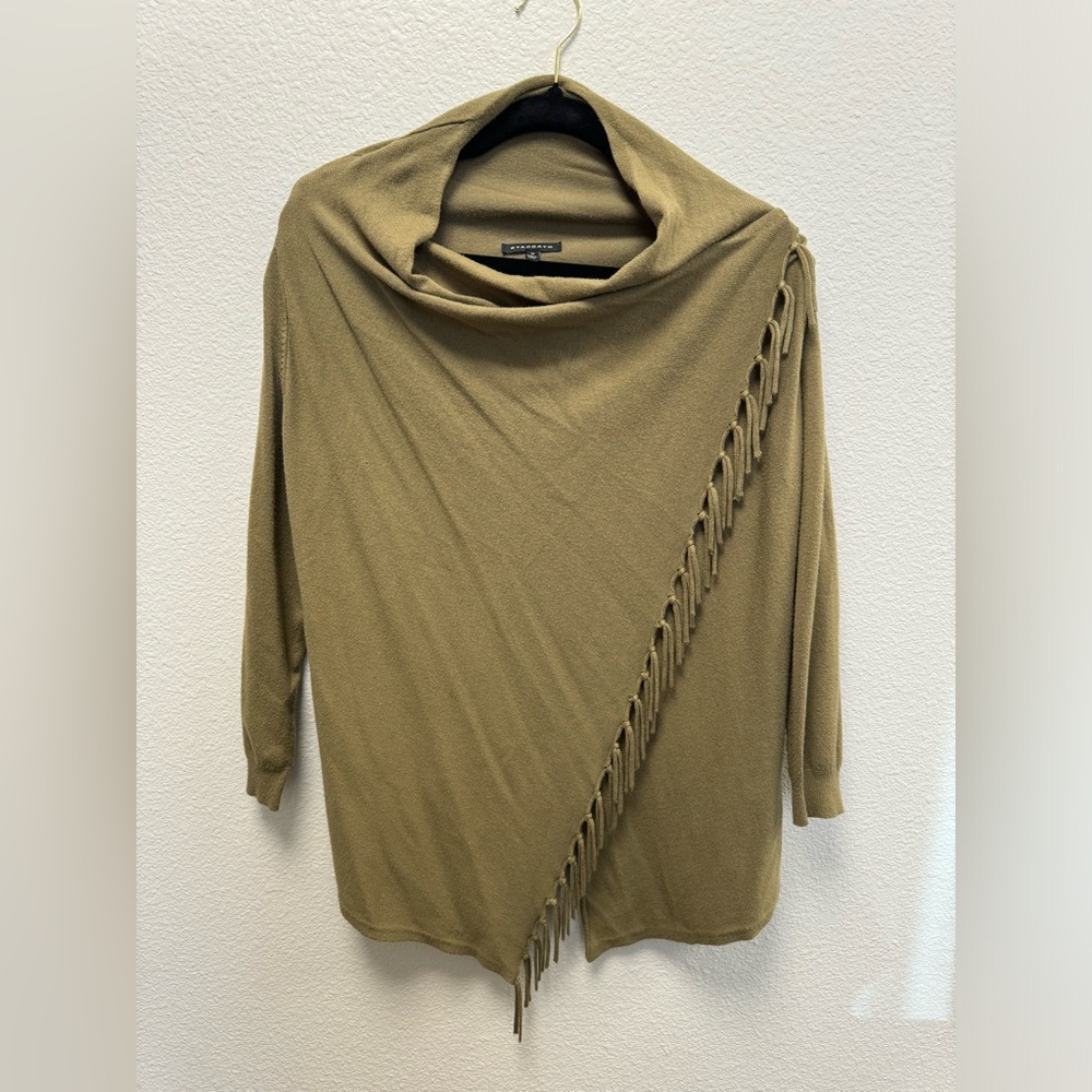 Sweater wrap that buttons on the top of the left shoulder.